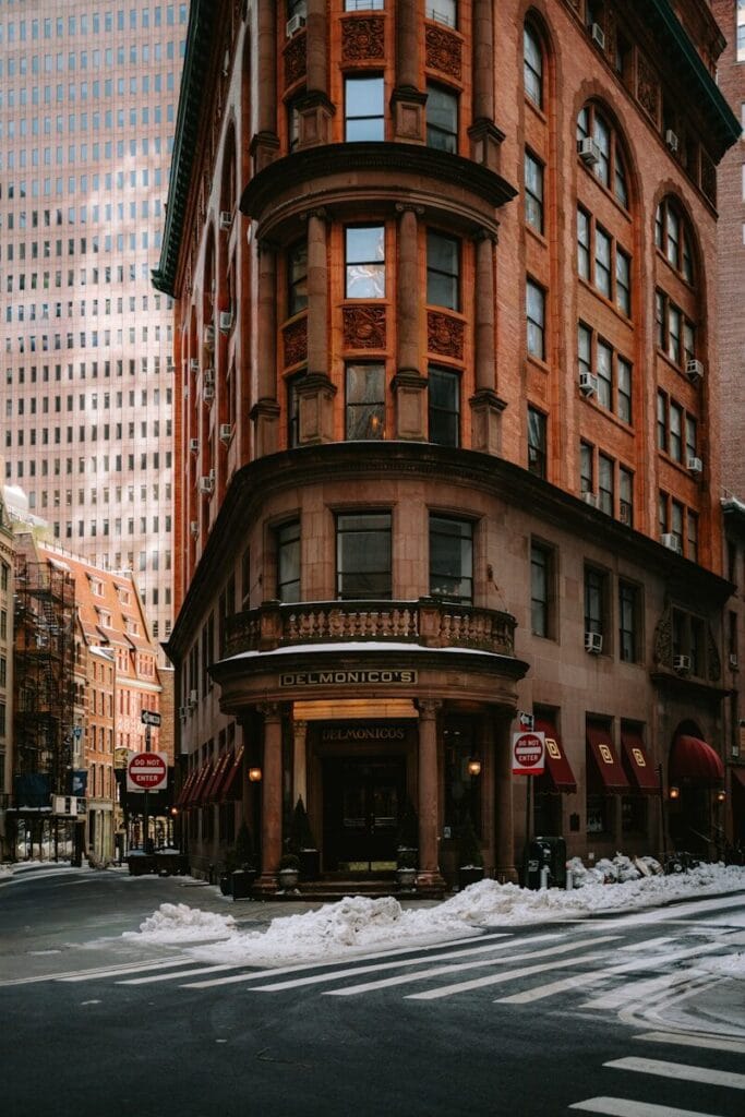 Ornate building corner on a snowy city street.