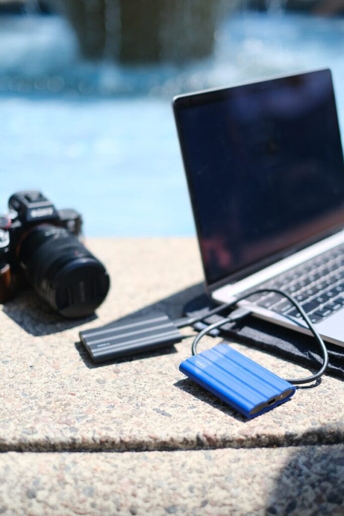 a laptop and camera on a table